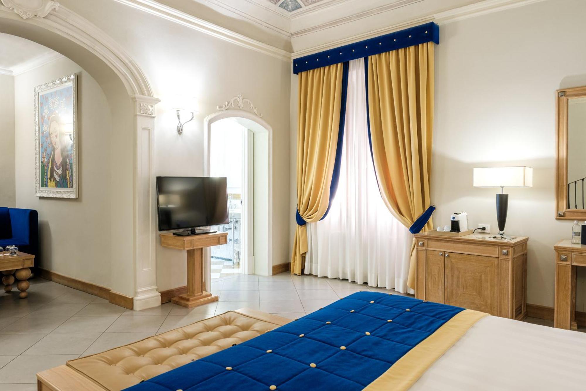 فندق ومنتجع فيلا تولومي فلورنس المظهر الخارجي الصورة A bedroom at the hotel