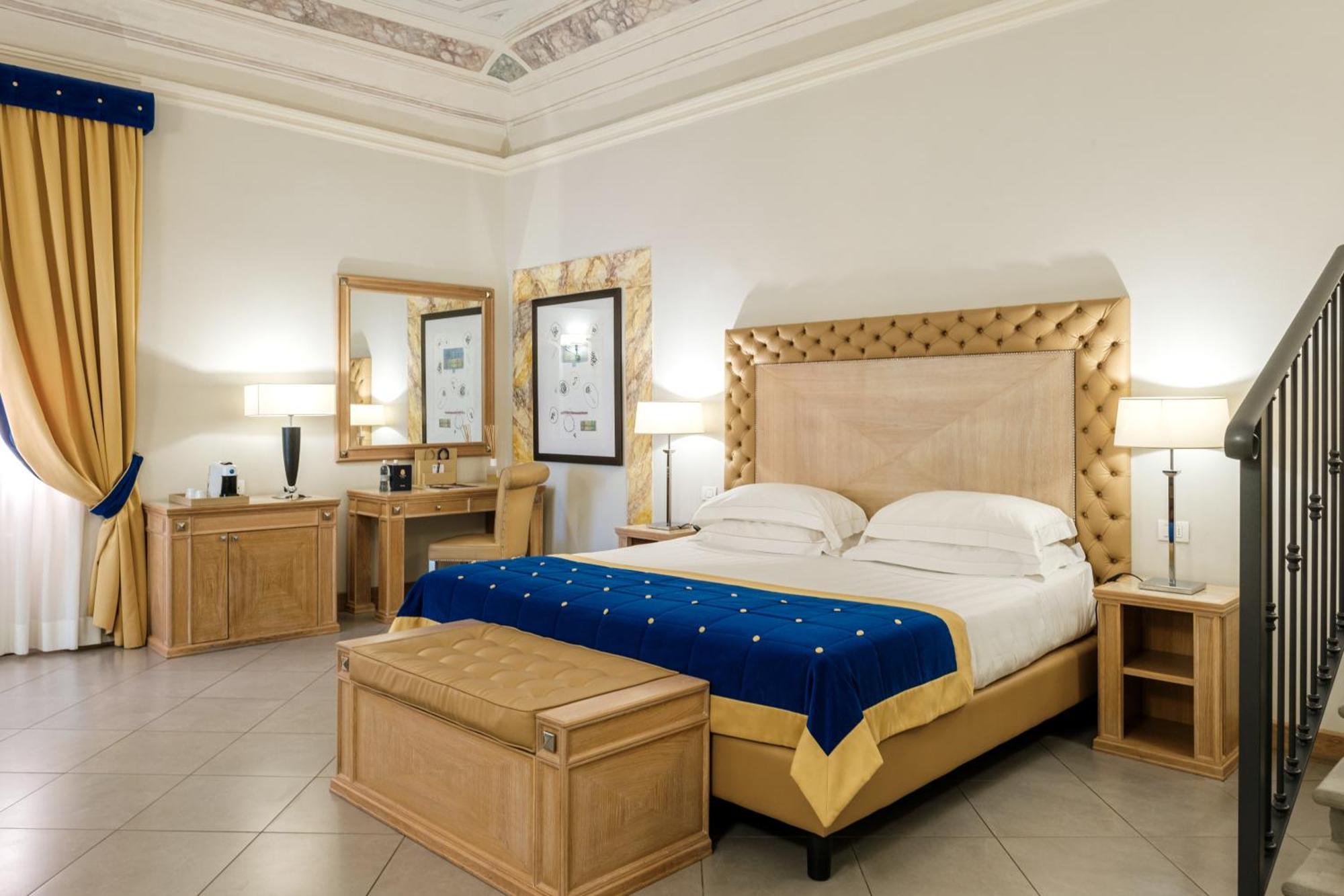 فندق ومنتجع فيلا تولومي فلورنس المظهر الخارجي الصورة A bedroom at the hotel