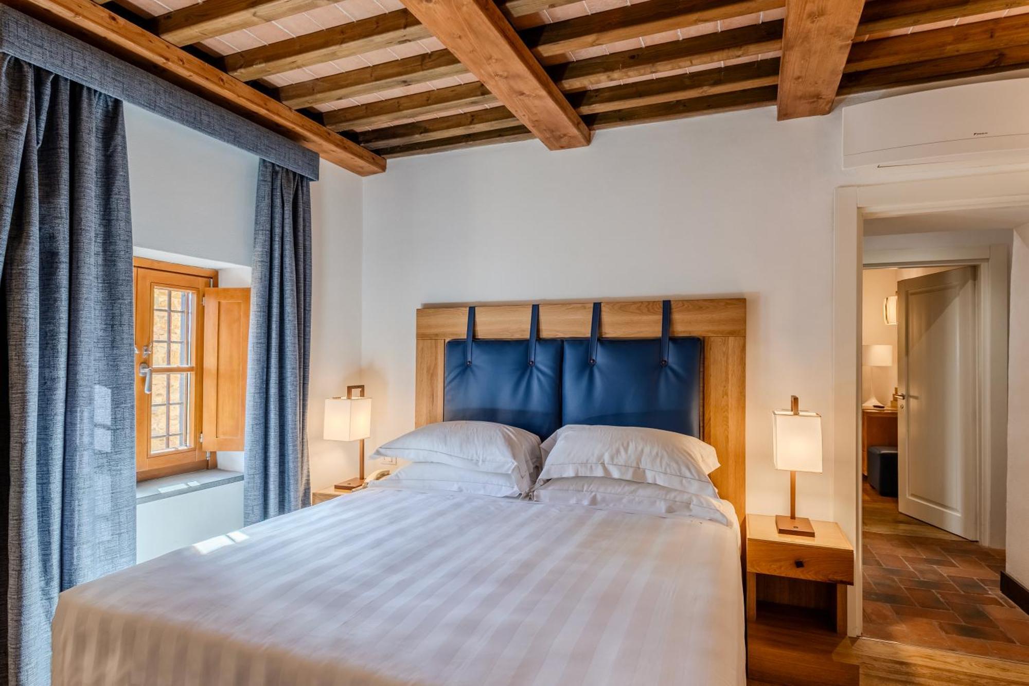 فندق ومنتجع فيلا تولومي فلورنس المظهر الخارجي الصورة A bedroom at the hotel